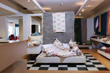 Showroom LethesHome elegant dining and bedroom decor with floral accents and cozy textiles